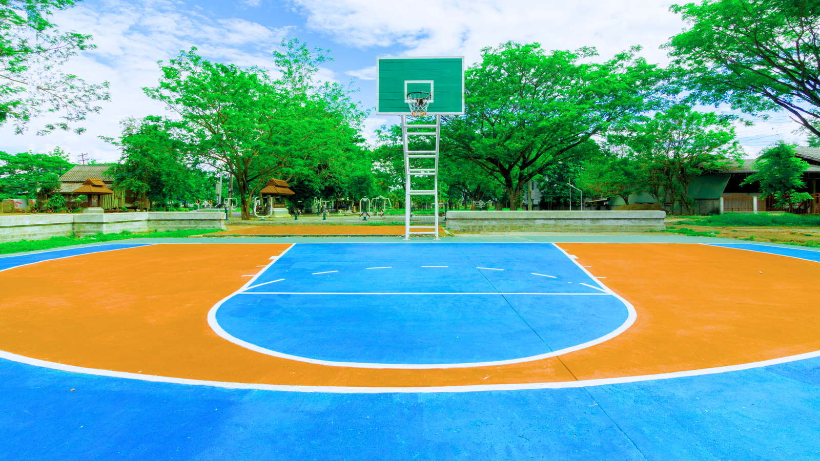 Well-lit indoor basketball court with bright lights and clear visibility, showcasing ideal products for court enhancement.