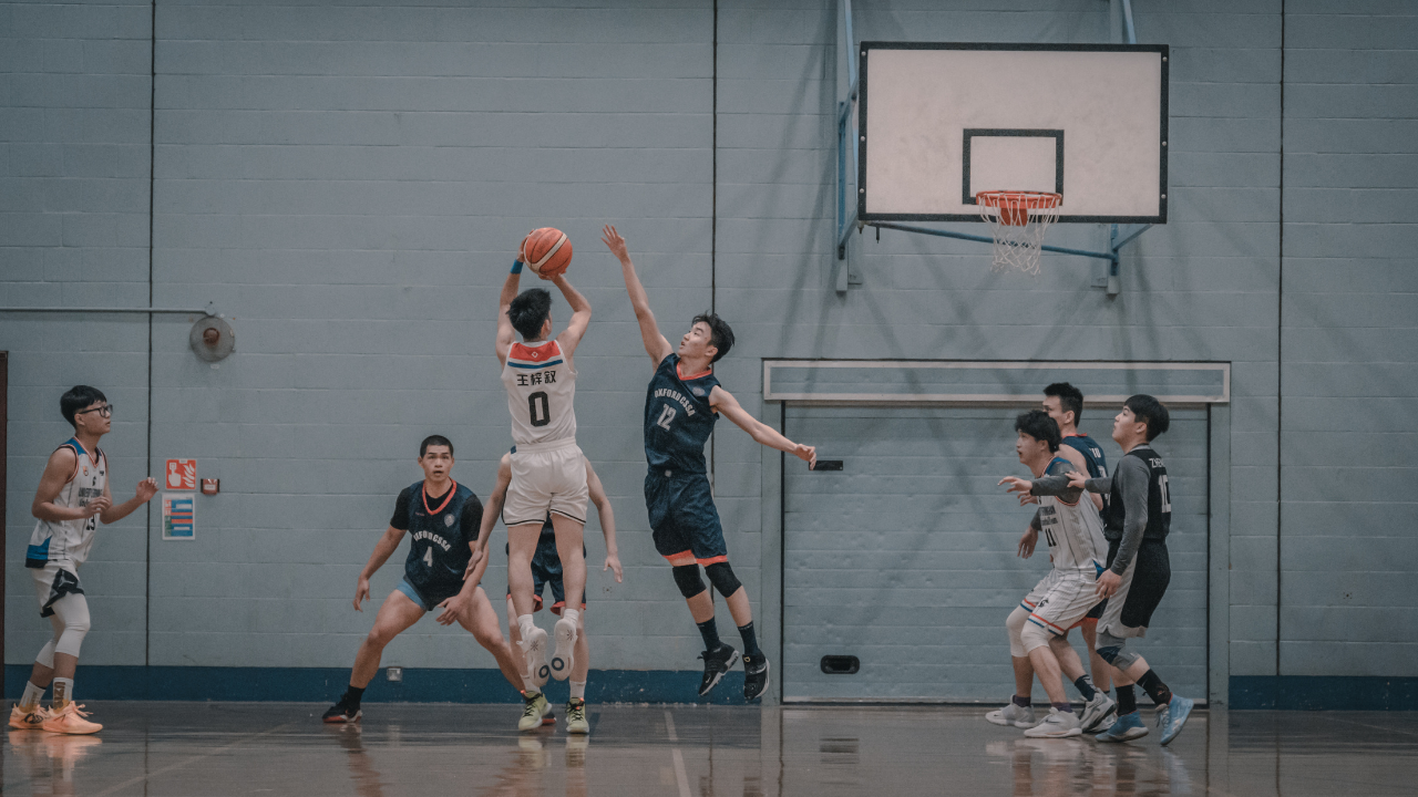 Fans celebrating a basketball game, highlighting the deep-rooted traditions of the sport.