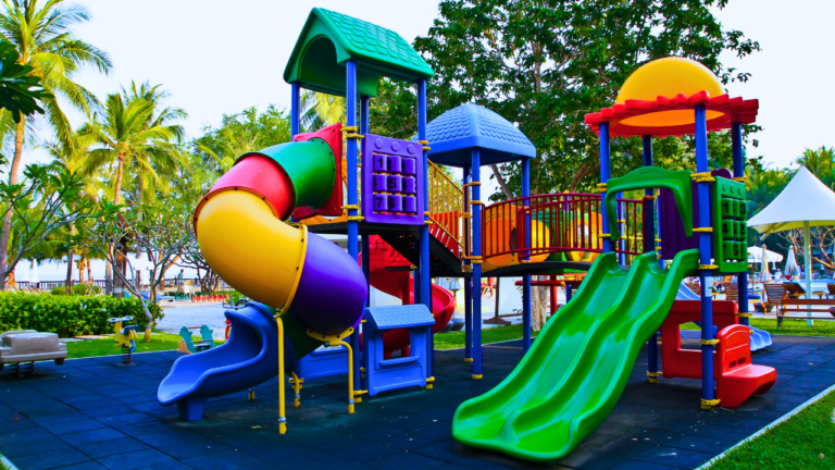 Children playing on Multi Play Stations in a vibrant playground, showcasing various interactive features and activities.