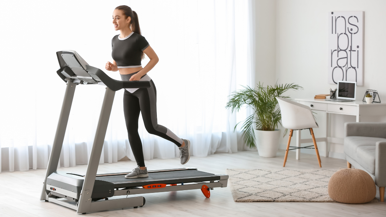 Person running on a treadmill, showcasing the benefits of treadmill workouts.