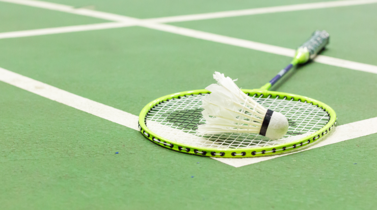 Player dominating the badminton court with a powerful smash.