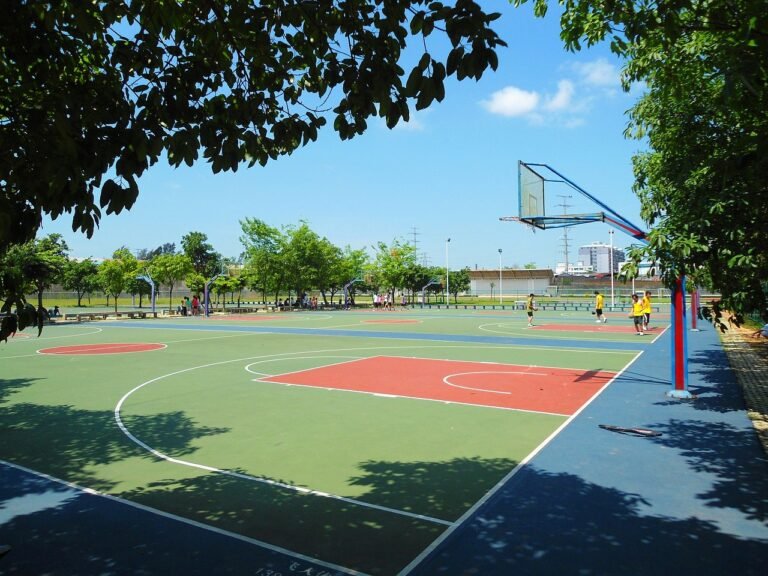 Different types of basketball court flooring materials and options laid out in a sports facility.