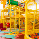 Children enjoying activities in an indoor play area in India.