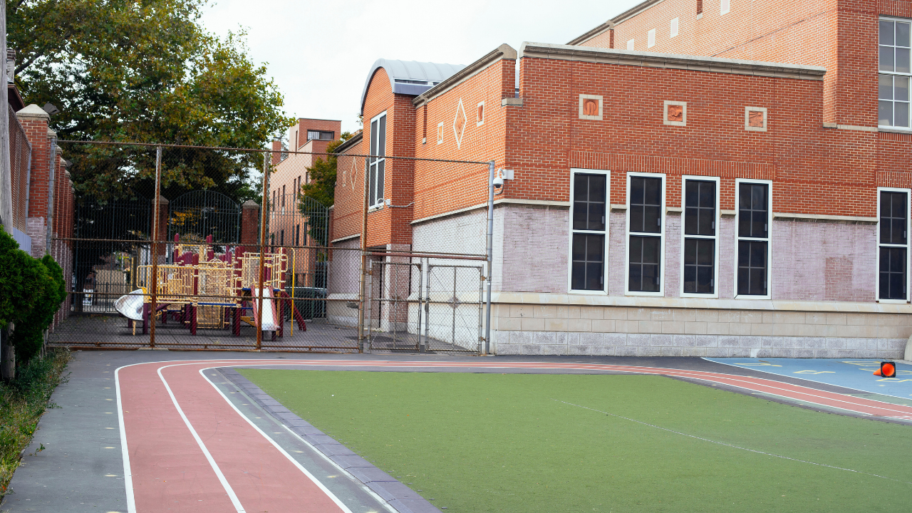 A well-maintained tennis court showcasing a durable, high-performance surface designed for safety and optimal traction.