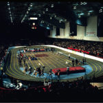 A group of athletes playing an indoor sport, working together to achieve a winning goal.